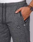 close-up of heather grey sweatpants zipper pocket and waistband
