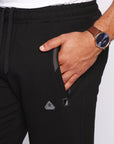 close-up of big and tall men’s black athletic sweatpants showing front zipper pocket and drawcord waistband