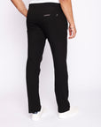 back view of men’s black sweatpants with straight leg cut, zippered back pocket, and stretch waistband, worn by male