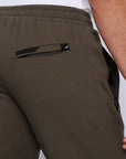 close-up of tall men’s khaki athleisure pants with secure back zipper pocket