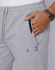 close-up of tall men’s light grey sweat pants with zipper pocket and waistband