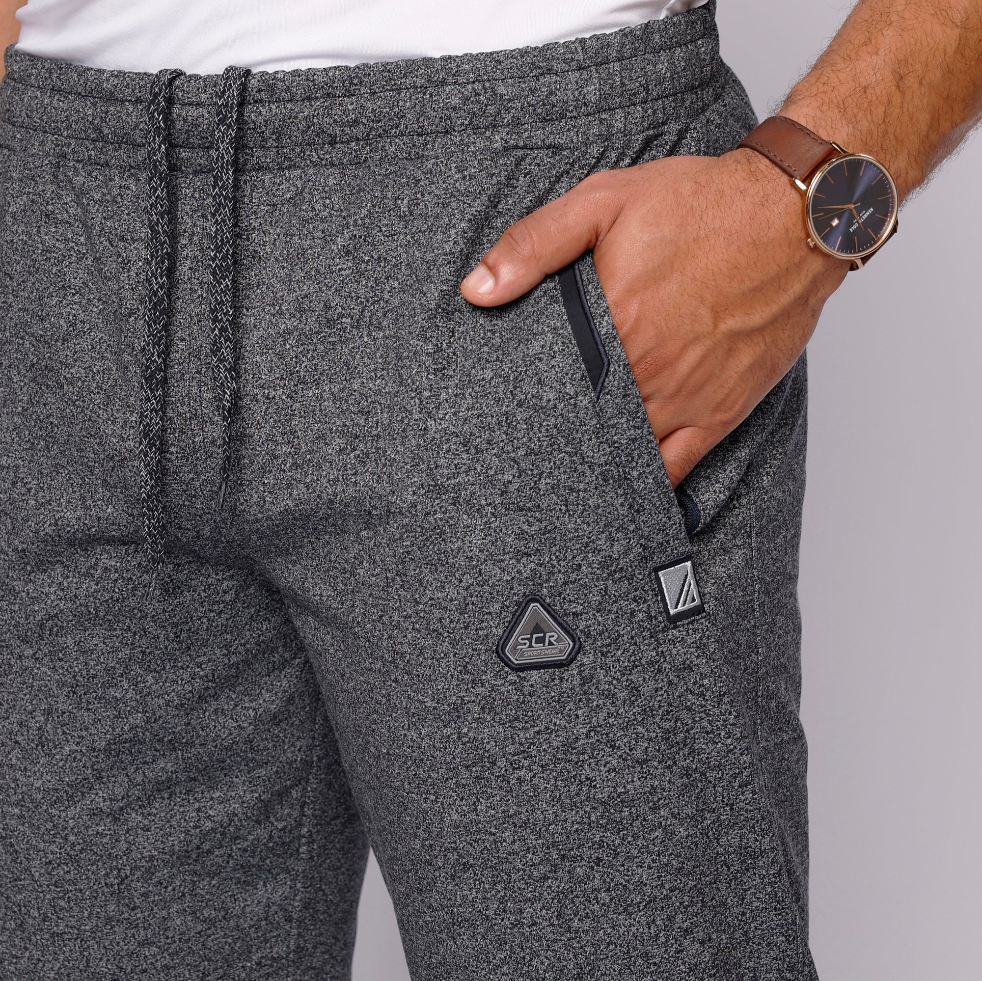 close-up of heather grey sweatpants zipper pocket and waistband