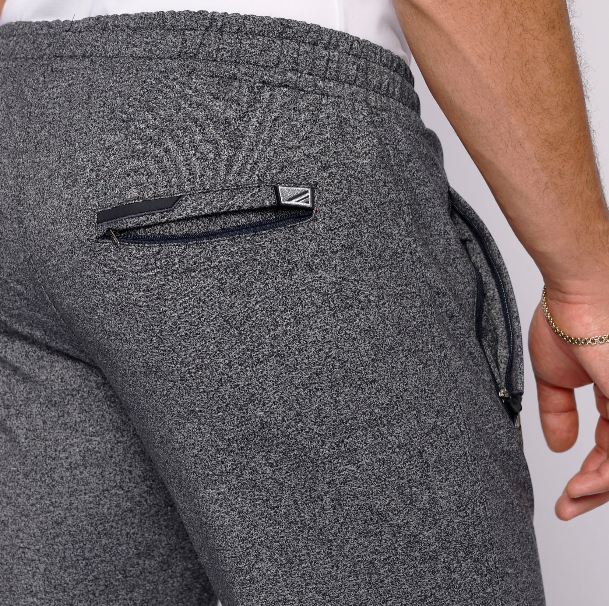 close-up of heather grey sweatpants back zipper pocket detail
