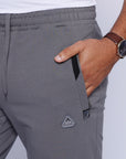 close-up of big and tall men’s athletic pants showing front zipper pocket and stretch waistband