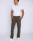 man wearing khaki green athletic pants in studio lifestyle view