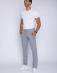 big and tall male model wearing light grey long-inseam athletic pants, lifestyle view