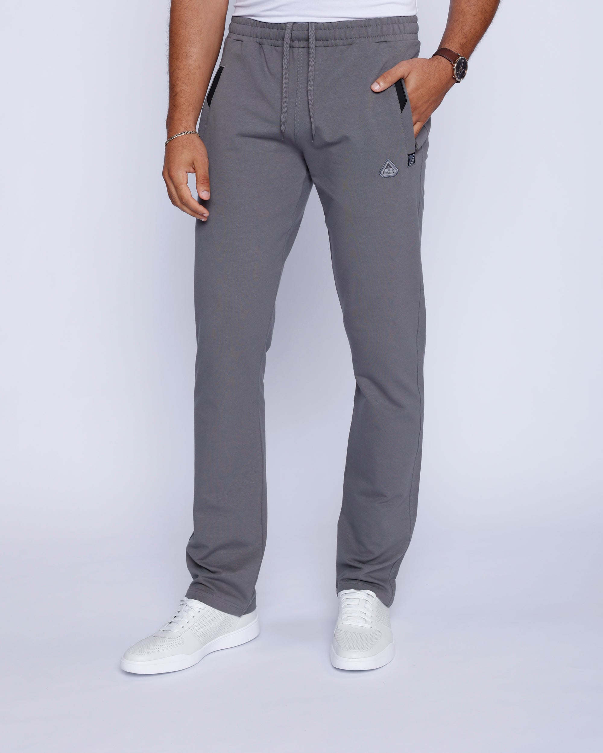 men’s light grey sweatpants worn by male model, front full-body view with stretch waistband with drawcord.