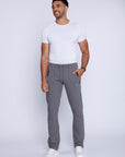  men’s light grey sweatpants straight leg style, full-length lifestyle view worn by male model.