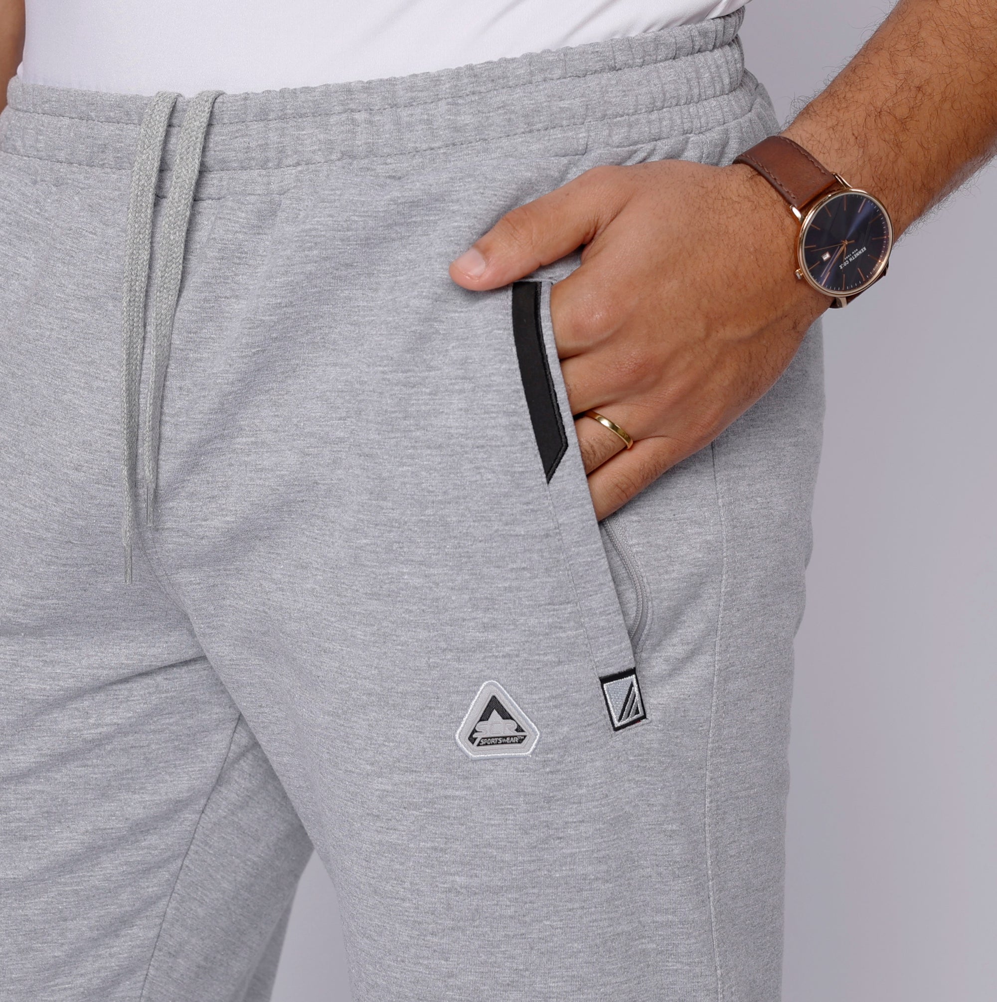  close-up of tall men’s light grey sweat pants with zipper pocket and waistband