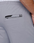 close-up of tall men’s grey athletic sweatpants with back zipper pocket