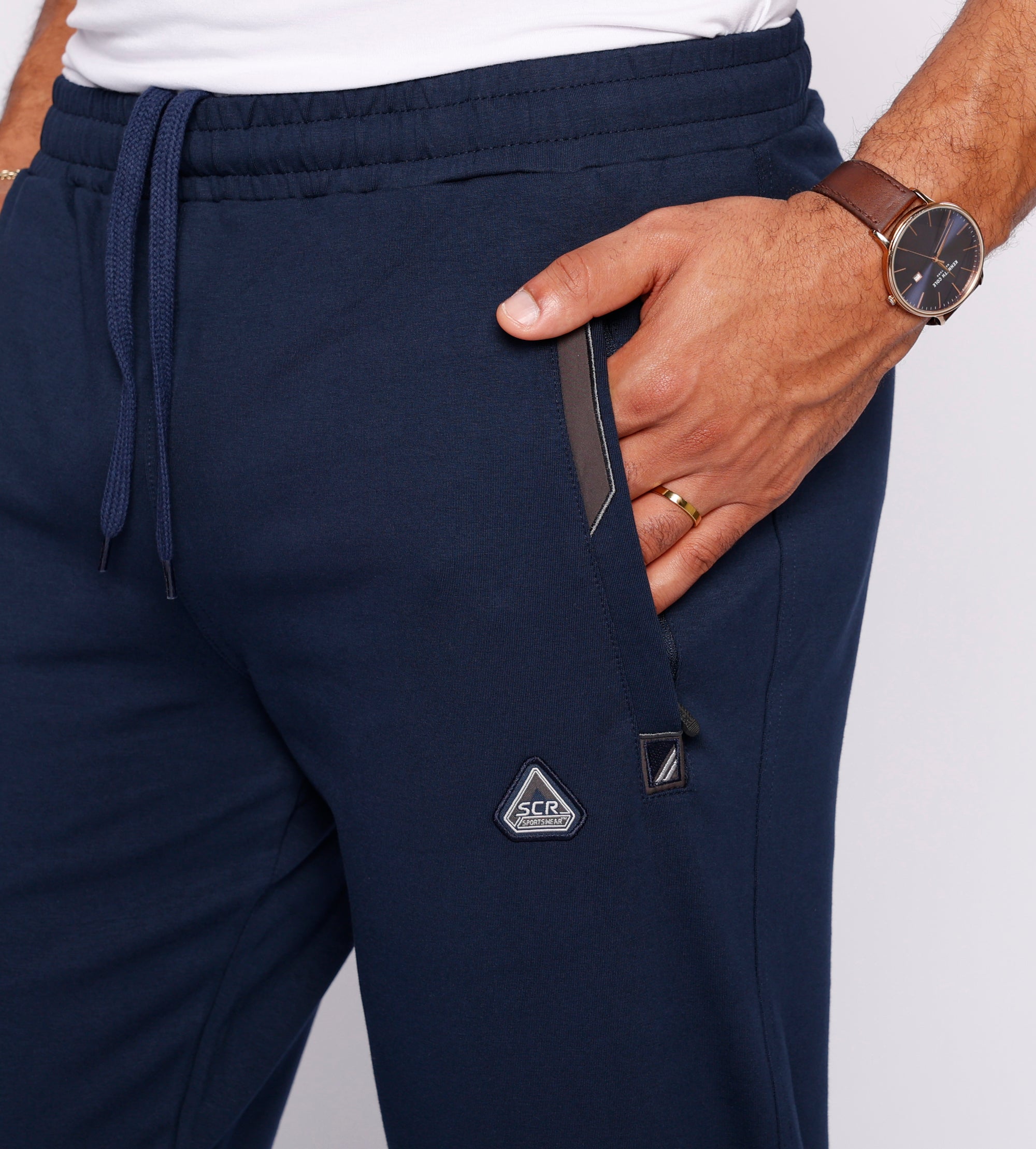 close-up of navy tall men’s sweatpants showing front zipper pocket and waistband